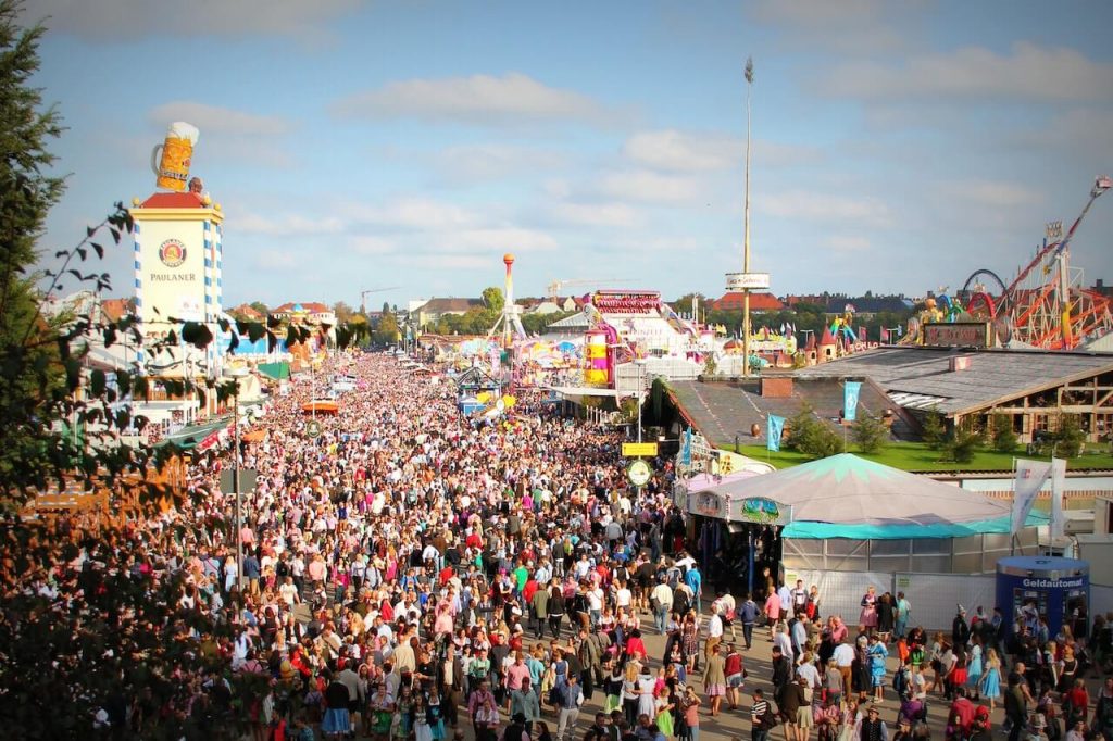 Large crowd of people gathered at Oktoberfest.